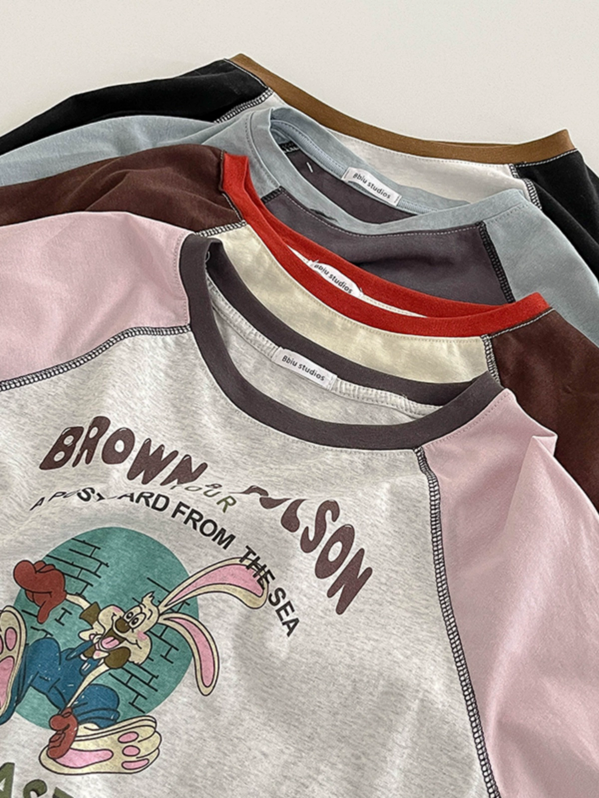 圆领撞色卡通印花T恤2024秋季新款女长袖简约套头洋气插肩上衣潮